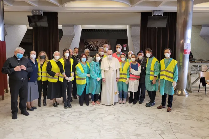 Pope Francis with medical workers and volunteers in the Pope Paul VI Hall COVID-19 vaccination center at the Vatican April 2, 2021.
